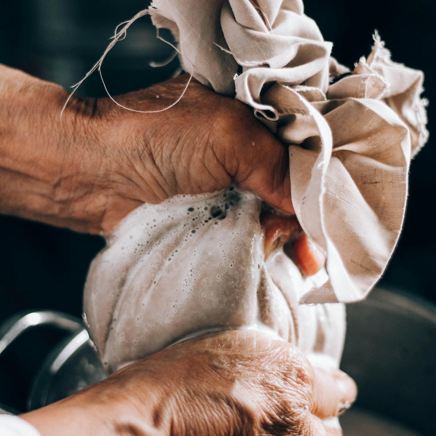 Diverse group of community members sharing a meal together, illustrating the bonds formed through collaborative cooking